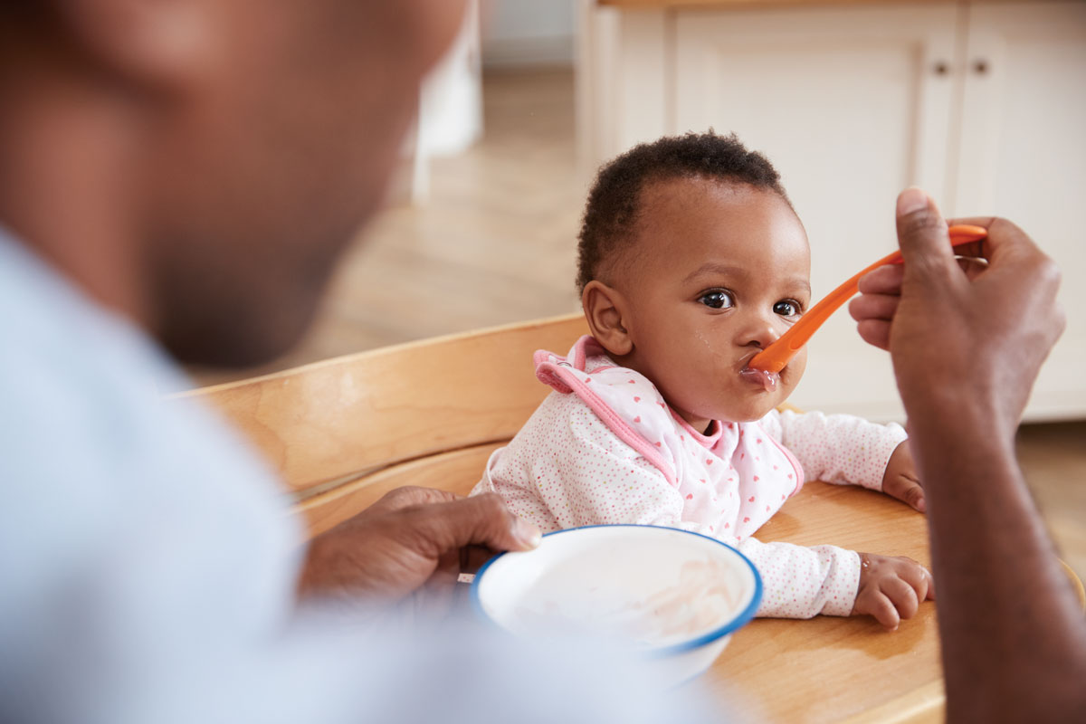 Dad-feeding-baby