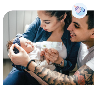 woman and man hold child while bottle feeding. 